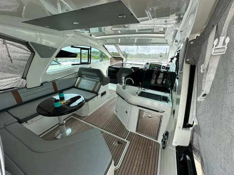 Slide: The Image of Interior of 2021 Beneteau GT 32 yacht with modern seating and sleek design. - 19