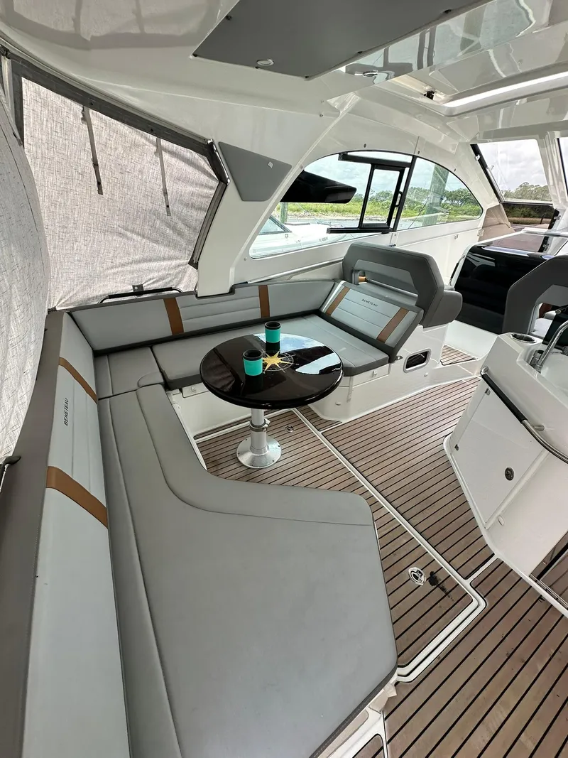 Slide: The Image of 2021 Beneteau GT 32 yacht interior with sleek seating and modern design. - 21