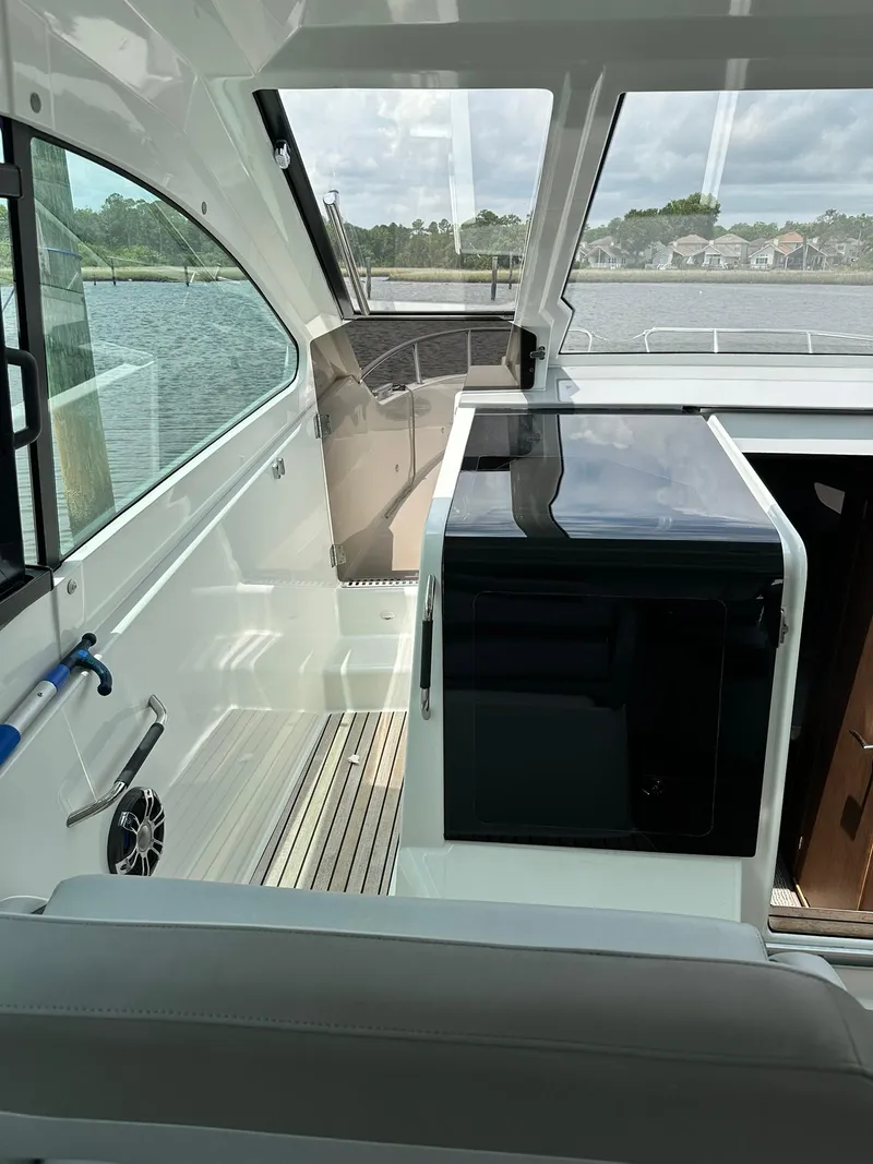Slide: The Image of 2021 Beneteau GT 32 yacht interior with sleek design and waterfront view. - 33