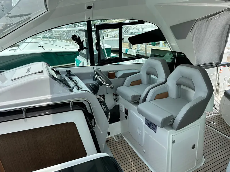 Slide: The Image of Interior of 2021 Beneteau GT 32 boat with modern helm and seating. - 36