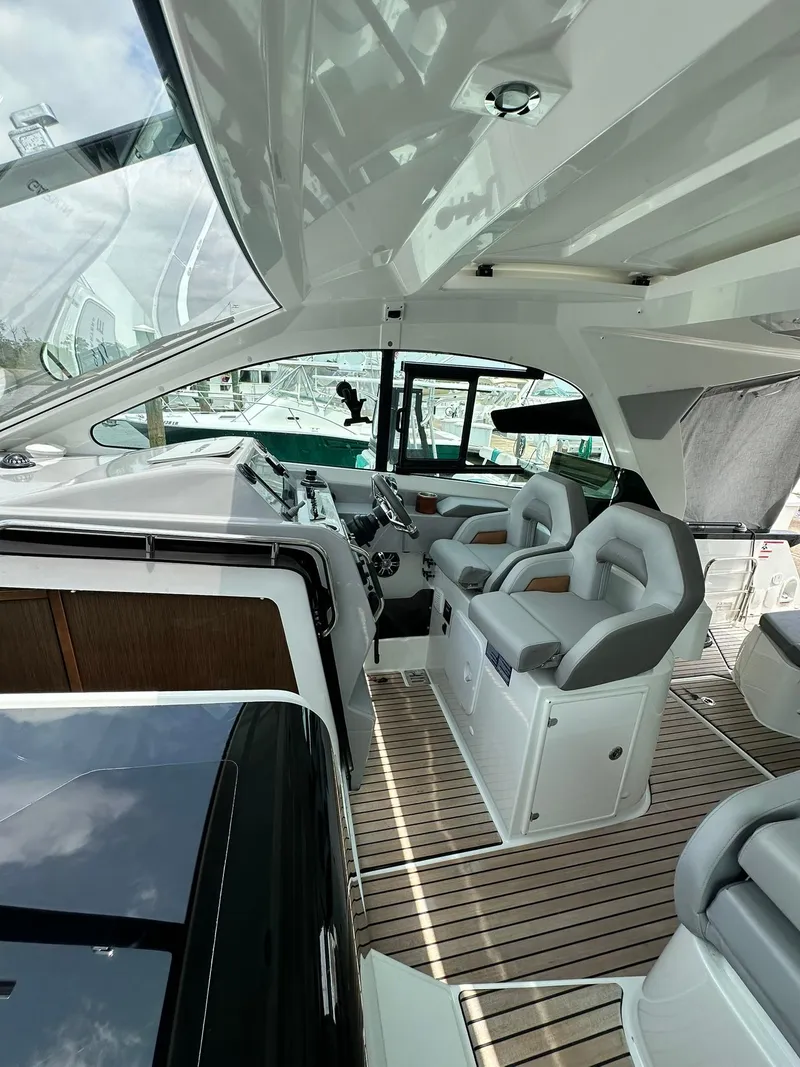 Slide: The Image of 2021 Beneteau GT 32 yacht interior with modern seating and sleek design. - 38