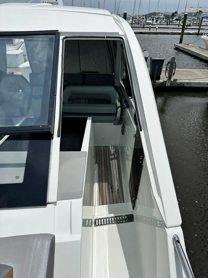 Slide: The Image of 2021 Beneteau GT 32 yacht docked at marina, showcasing sleek design and modern features. - 40