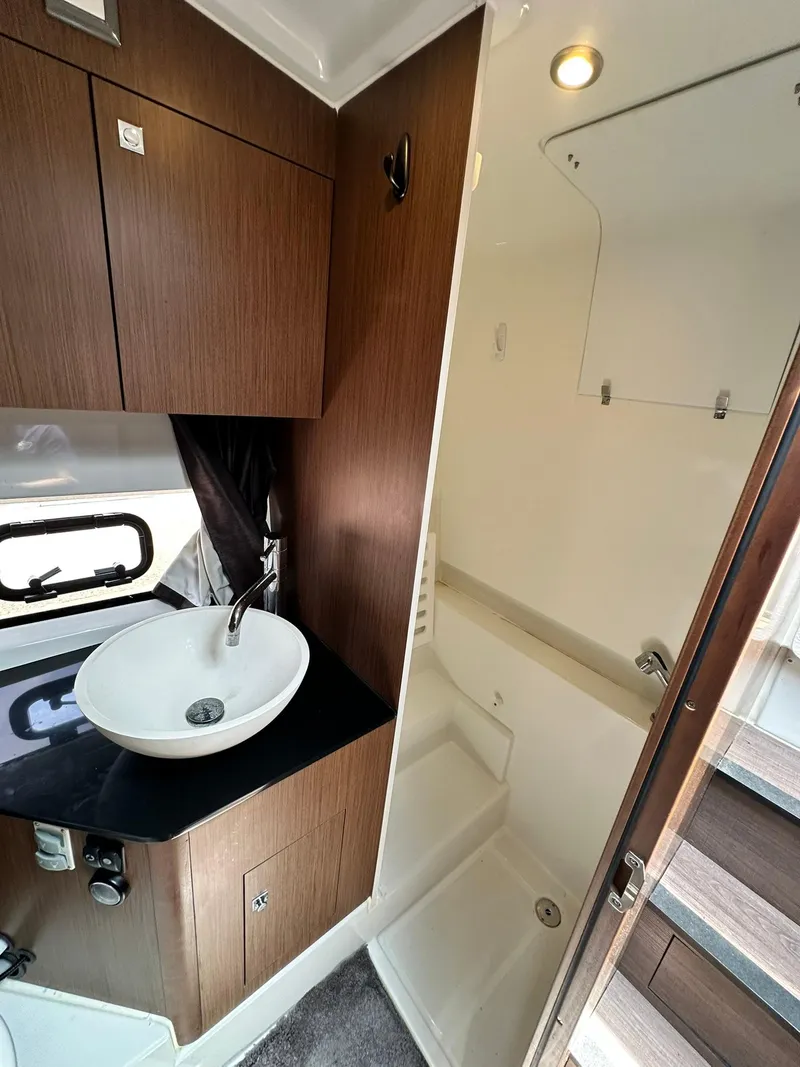 Slide: The Image of 2021 Beneteau GT 32 yacht bathroom with modern sink and shower. - 43