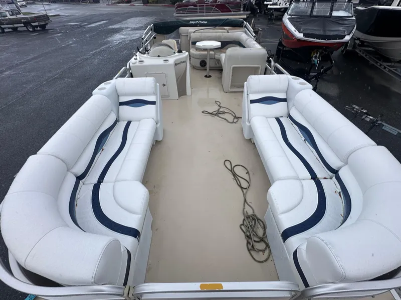 Slide: The Image of 2003 AquaPatio 240 RE pontoon boat with spacious seating and clean deck. - 8