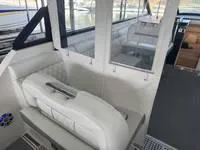 Slide: The Image of 2023 Regal 36 Grande Coupe helm with modern controls and luxurious seating. - 15