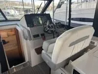 Slide: The Image of Interior of 2023 Regal 36 Grande Coupe yacht with luxurious seating and cabin view. - 16