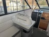 Slide: The Image of 2023 Regal 36 Grande Coupe interior with elegant seating and table setup. - 17