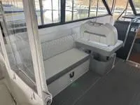 Slide: The Image of 2023 Regal 36 Grande Coupe helm with modern controls and digital display. - 18