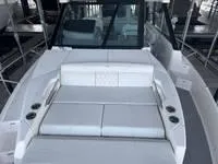 Slide: The Image of Luxurious cabin interior of 2023 Regal 36 Grande Coupe with cozy bedding and soft lighting. - 29