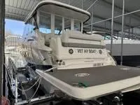 Slide: The Image of 2023 Regal 36 Grande Coupe yacht docked in a covered marina. - 3