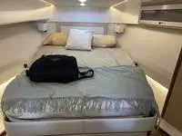 Slide: The Image of Interior of 2023 Regal 36 Grande Coupe with white seating and wooden steps. - 31