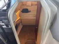 Slide: The Image of Luxurious cabin interior of 2023 Regal 36 Grande Coupe yacht with cozy bedding. - 33