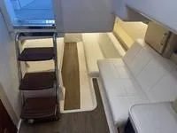 Slide: The Image of Interior cabin of 2023 Regal 36 Grande Coupe with modern design and TV. - 34