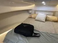 Slide: The Image of Luxurious interior of 2023 Regal 36 Grande Coupe with white leather seating. - 36