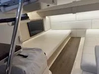 Slide: The Image of 2023 Regal 36 Grande Coupe interior with modern seating and sleeping area. - 38