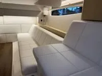 Slide: The Image of 2023 Regal 36 Grande Coupe bathroom with modern sink and wooden cabinetry. - 39