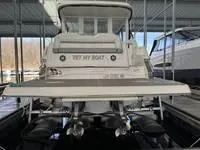 Slide: The Image of 2023 Regal 36 Grande Coupe boat docked in covered marina. - 4