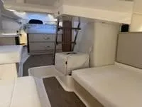 Slide: The Image of 2023 Regal 36 Grande Coupe docked in a covered marina. - 41