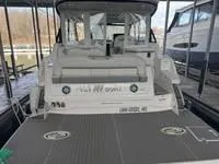 Slide: The Image of 2023 Regal 36 Grande Coupe interior with modern seating and clear enclosures. - 9