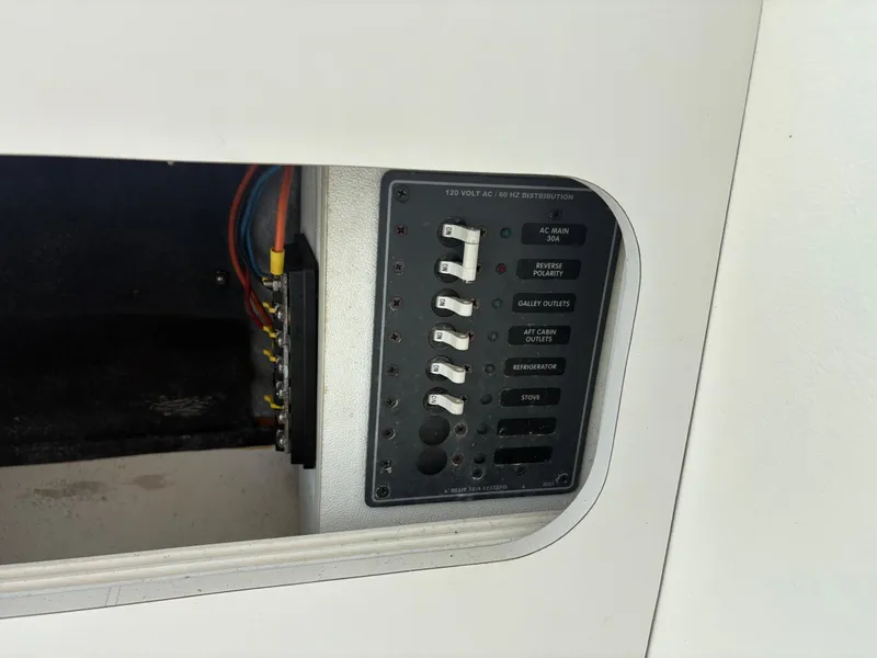 Slide: The Image of Control panel of a 1998 Penn Yan 269 Legend boat with labeled switches. - 17