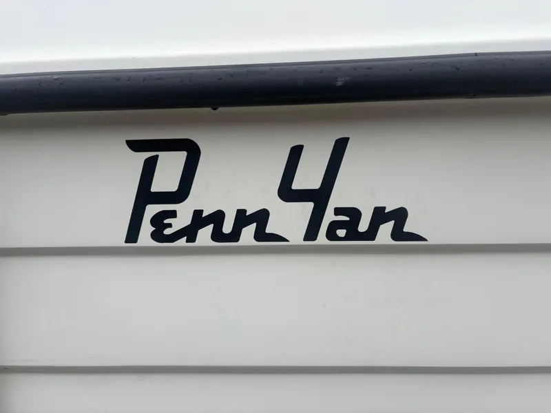 Slide: The Image of Penn Yan 269 Legend 1998 boat logo on white surface. - 4
