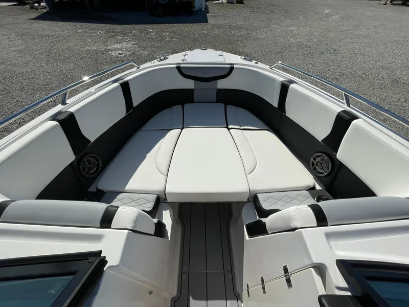 Slide: The Image of 2025 Chaparral 270 OSX boat interior with sleek seating and modern design. - 10