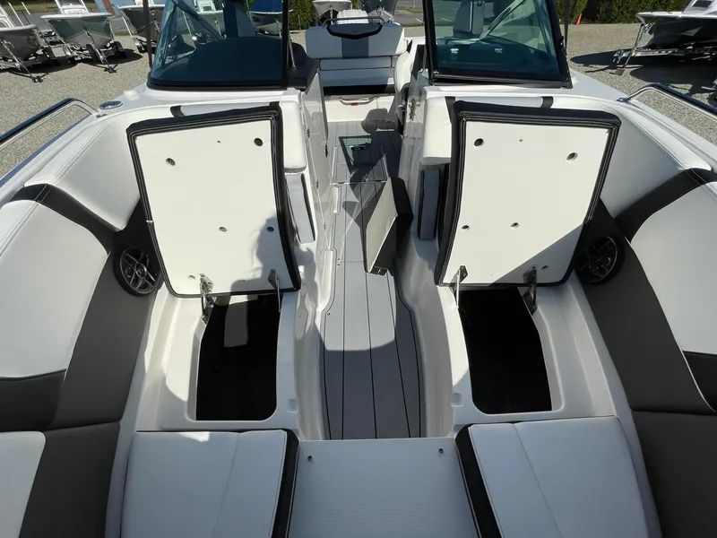 Slide: The Image of 2025 Chaparral 270 OSX boat interior with sleek seating and modern design. - 20