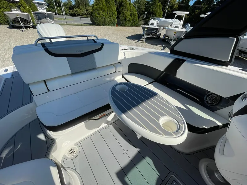 Slide: The Image of 2025 Chaparral 270 OSX boat interior with modern seating and dashboard. - 26