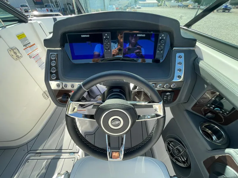 Slide: The Image of Dashboard of 2025 Chaparral 270 OSX boat with dual Simrad displays. - 32