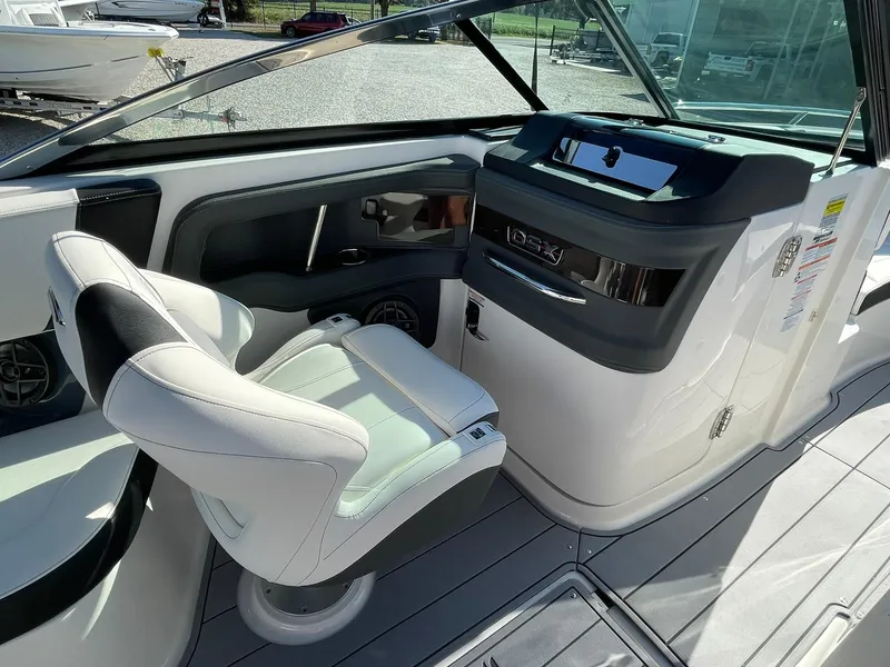 Slide: The Image of Interior view of 2025 Chaparral 270 OSX boat, featuring sleek seating and modern design elements. - 45
