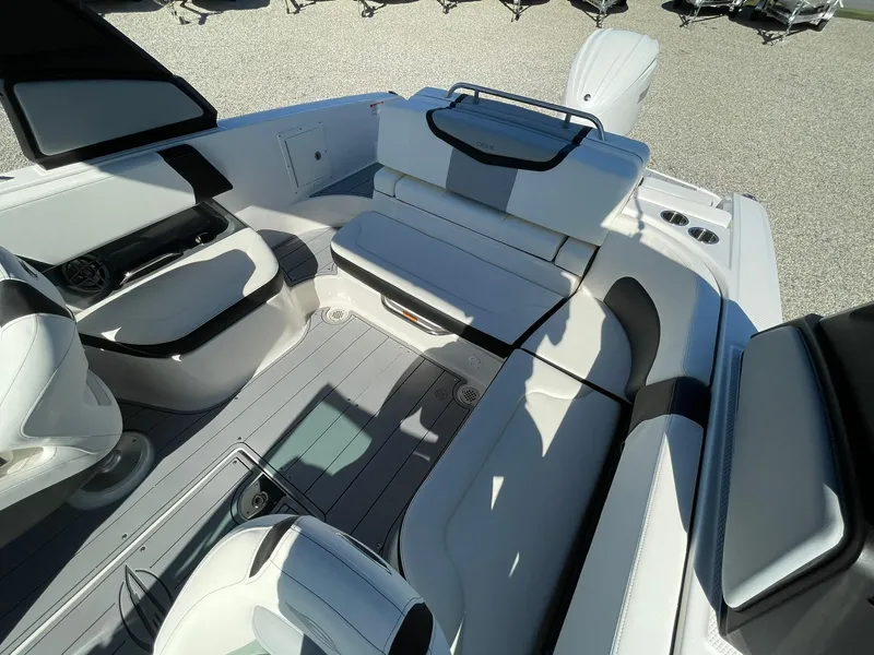 Slide: The Image of Interior of 2025 Chaparral 270 OSX boat, featuring sleek seating and modern design elements. - 47