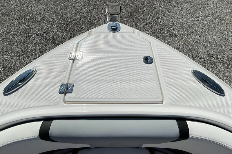 Slide: The Image of 2025 Chaparral 270 OSX boat cleat on textured deck surface. - 6