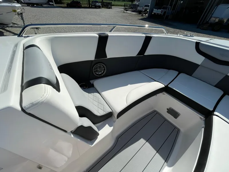 Slide: The Image of 2025 Chaparral 270 OSX boat interior with sleek seating and modern design. - 10