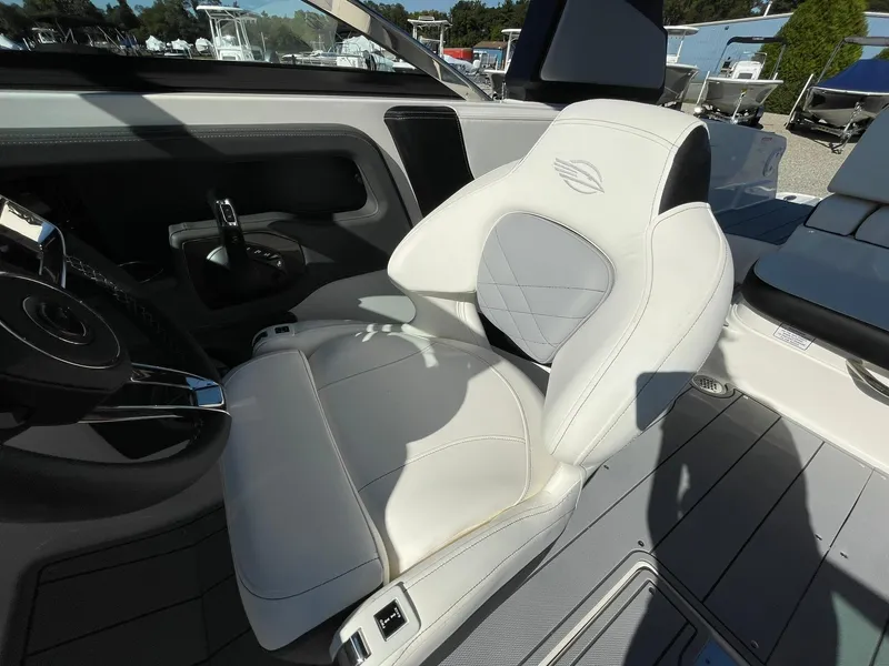 Slide: The Image of Luxury seating in 2025 Chaparral 270 OSX boat cockpit, featuring sleek design and premium materials. - 34