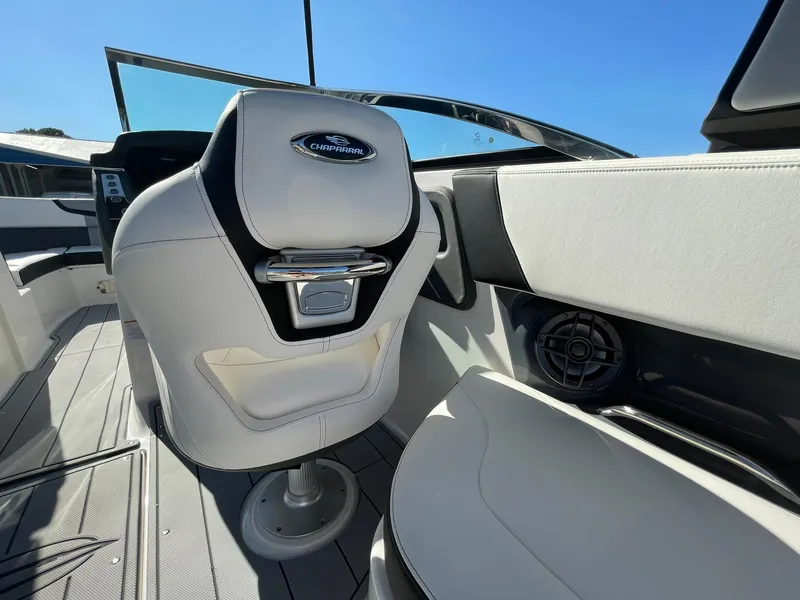 Slide: The Image of 2025 Chaparral 270 OSX boat interior with sleek seating and modern design. - 49
