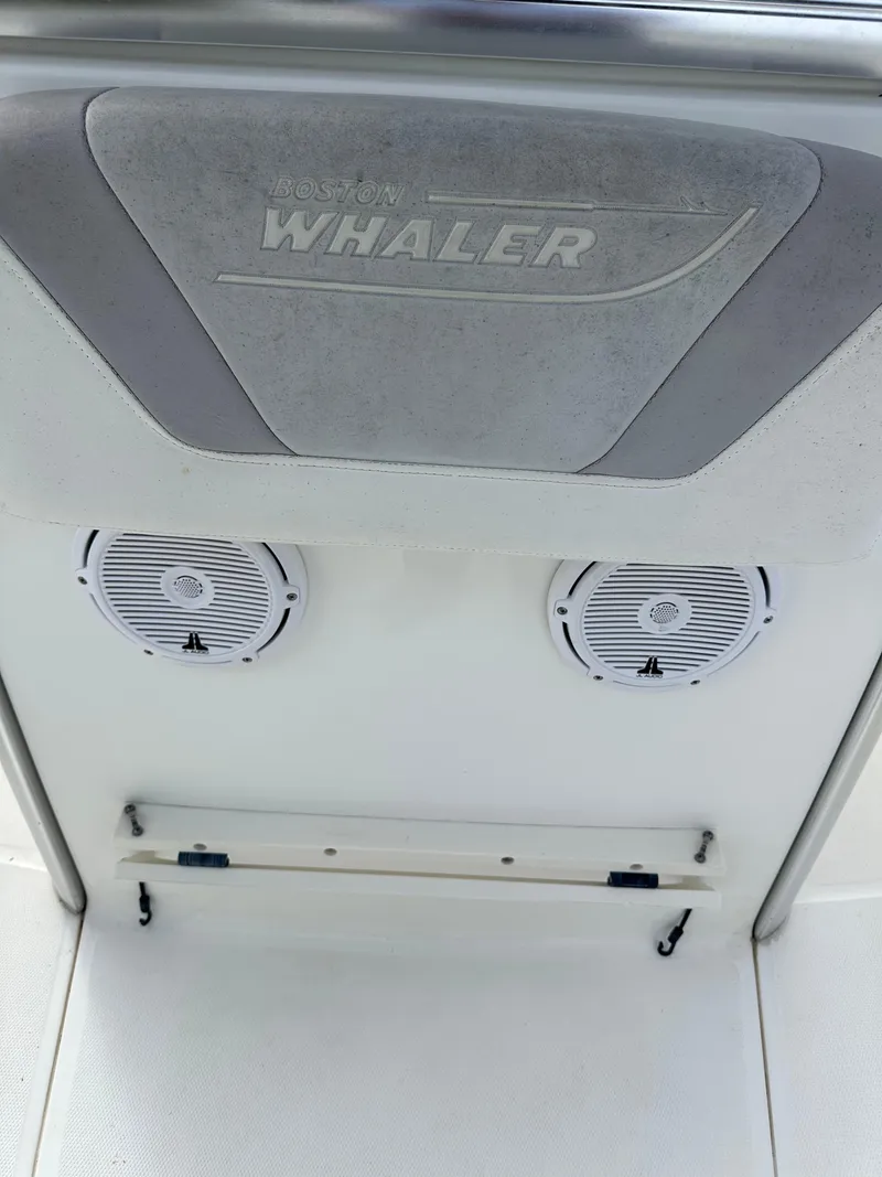 Slide: The Image of 2011 Boston Whaler 220 Outrage boat interior with speakers and logo. - 26