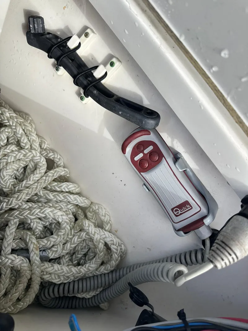 Slide: The Image of Storage compartment in a 2011 Boston Whaler 220 Outrage with rope and safety equipment. - 33