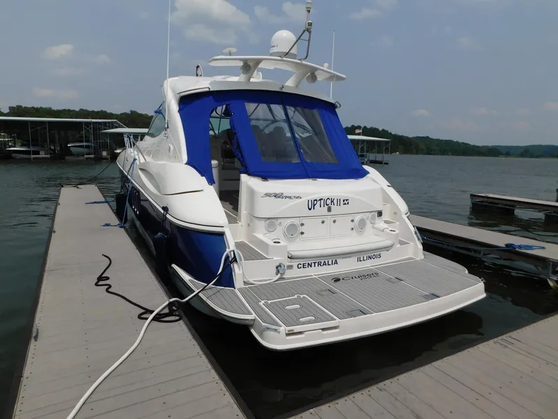 Slide: The Image of 2005 Cruisers Yachts 500 Express docked at a marina, rear view. - 14