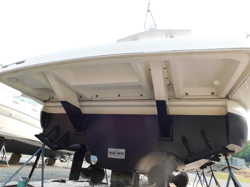 Slide: The Image of 2005 Cruisers Yachts 500 Express boat hull on stands, viewed from the rear. - 35