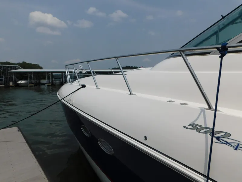 Slide: The Image of 2005 Cruisers Yachts 500 Express docked, showcasing sleek design and elegant lines. - 17