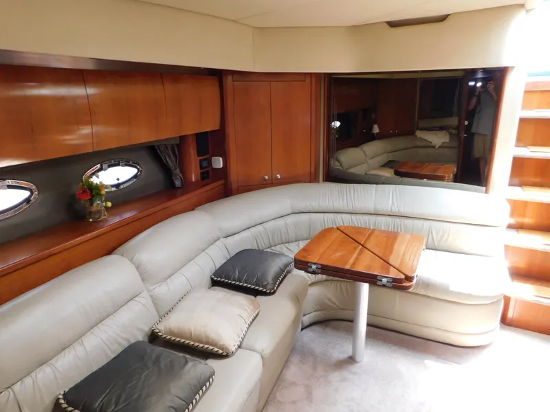 Slide: The Image of Luxurious interior of 2005 Cruisers Yachts 500 Express with plush seating and wooden accents. - 29
