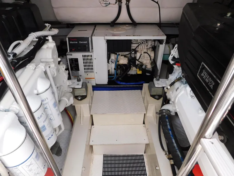 Slide: The Image of Engine room of 2005 Cruisers Yachts 500 Express, featuring mechanical components and equipment. - 42