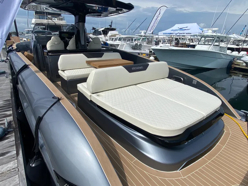 Slide: The Image of 2024 Solaris Power 40F Open yacht with luxurious seating at a marina. - 11