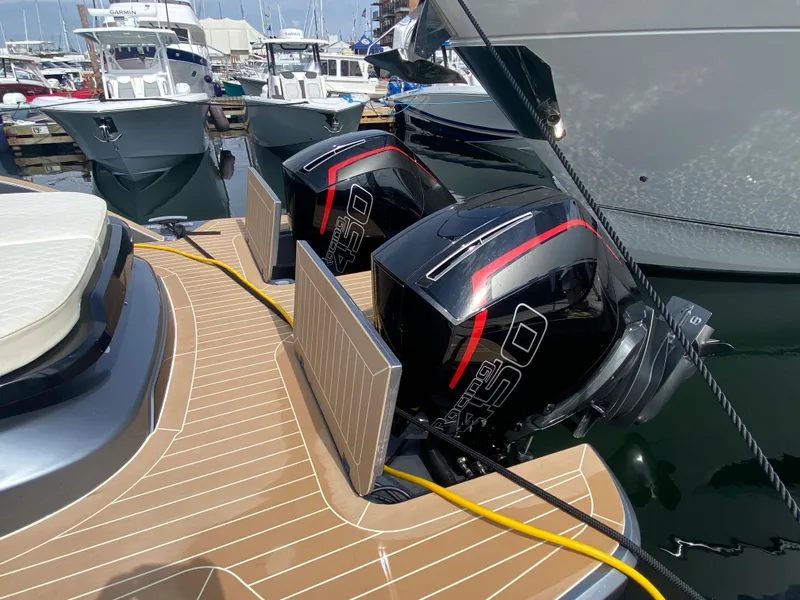 Slide: The Image of 2024 Solaris Power 40F Open yacht with dual outboard engines at marina. - 12