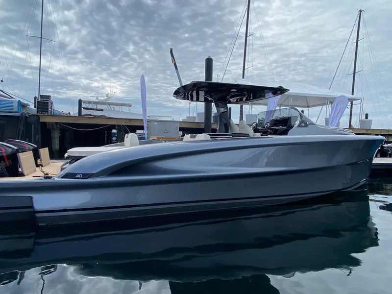 Slide: The Image of 2024 Solaris Power 40F Open yacht docked, showcasing sleek design and modern features. - 17