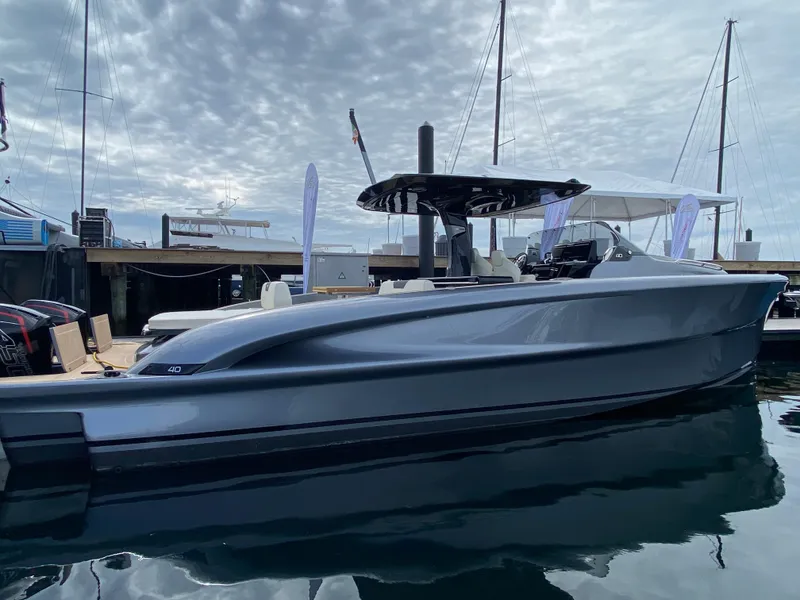 Slide: The Image of 2024 Solaris Power 40F Open yacht docked at marina under cloudy sky. - 18