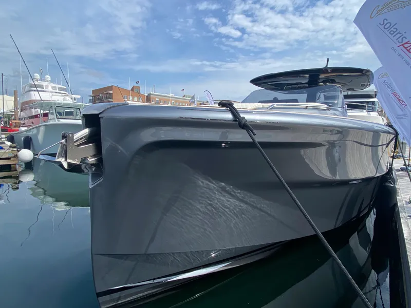 Slide: The Image of 2024 Solaris Power 40F Open yacht docked, showcasing sleek design and modern features. - 19