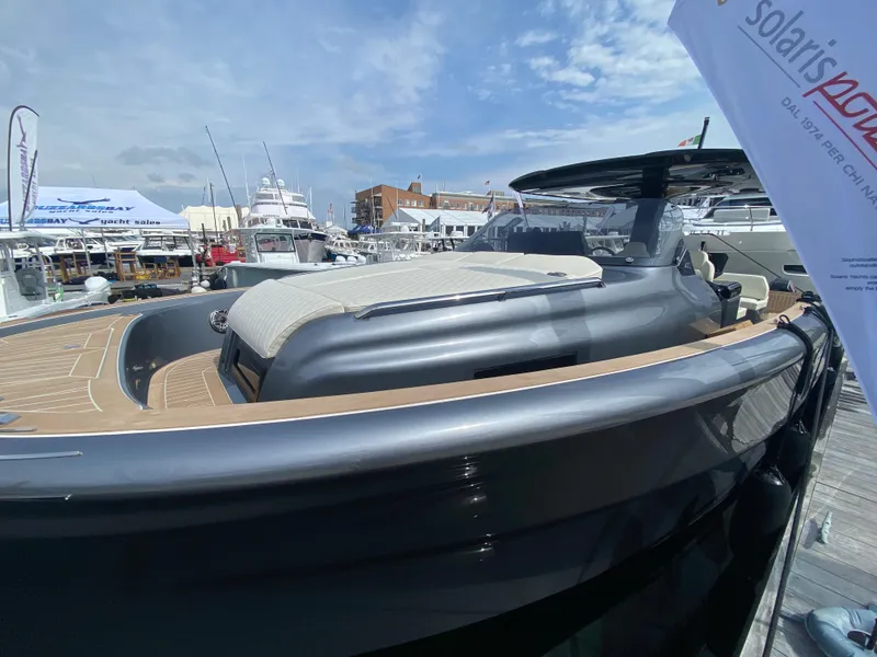 Slide: The Image of 2024 Solaris Power 40F Open yacht docked at marina, showcasing sleek design and luxury features. - 21