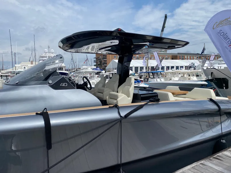 Slide: The Image of 2024 Solaris Power 40F Open yacht docked at marina under blue sky. - 23