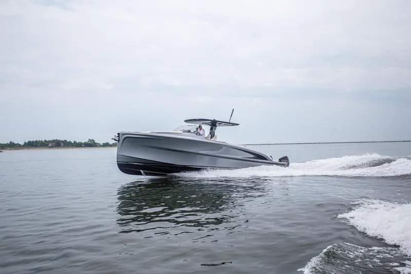 Slide: The Image of 2024 Solaris Power 40F Open yacht cruising on calm waters. - 3